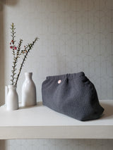 Clutch in tessuto goffrato