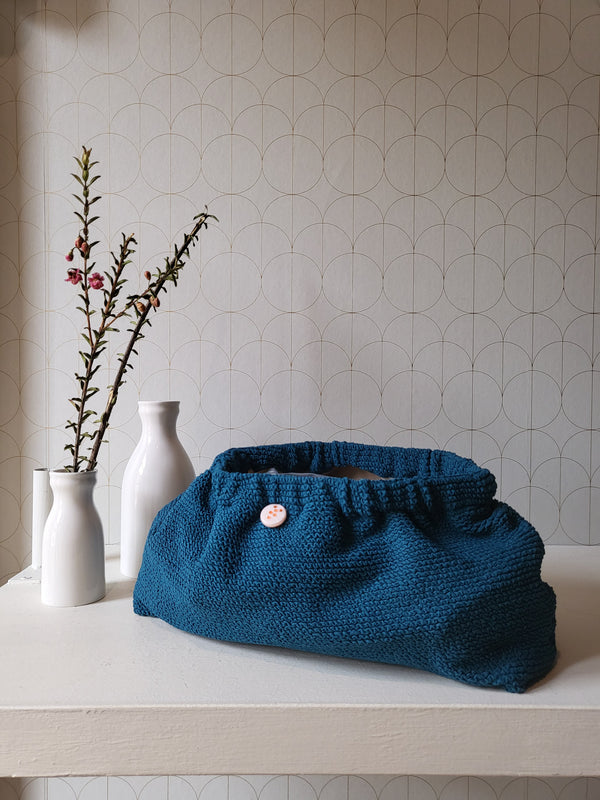 Clutch in tessuto goffrato