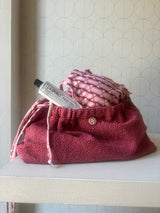 Clutch in tessuto goffrato